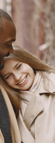 A couple, smiling. 