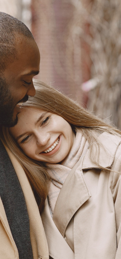 A couple, smiling. 