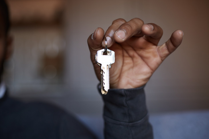 Black person holding keys