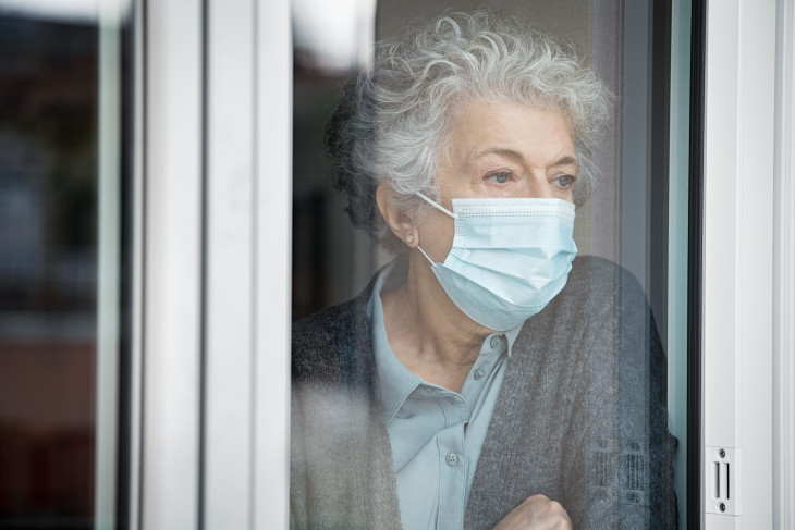 Woman staring out of window