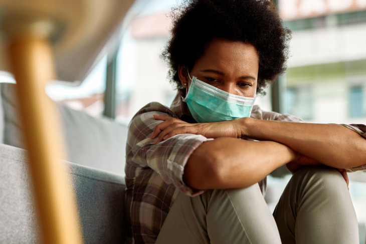 Black woman wearing a mask