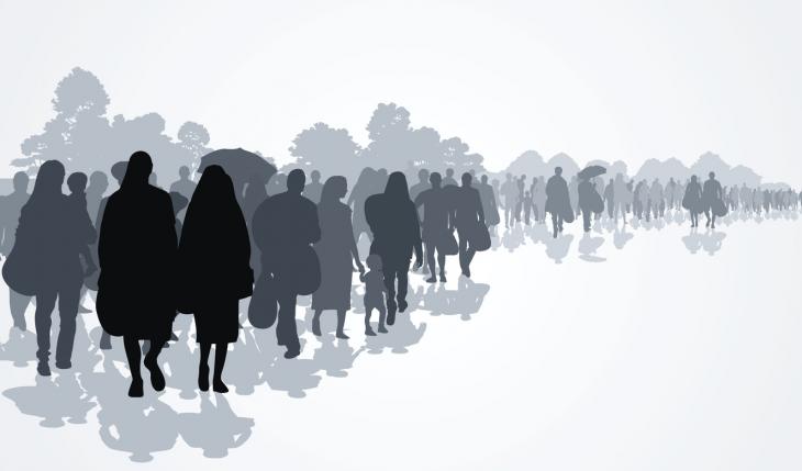 Silhouettes of refugees people searching new homes or life due to persecution