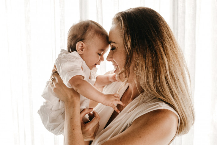 woman holding baby