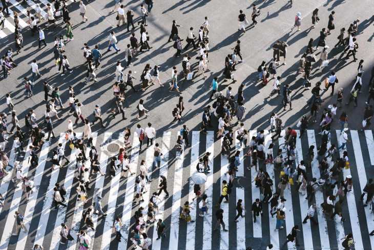 People walking across street