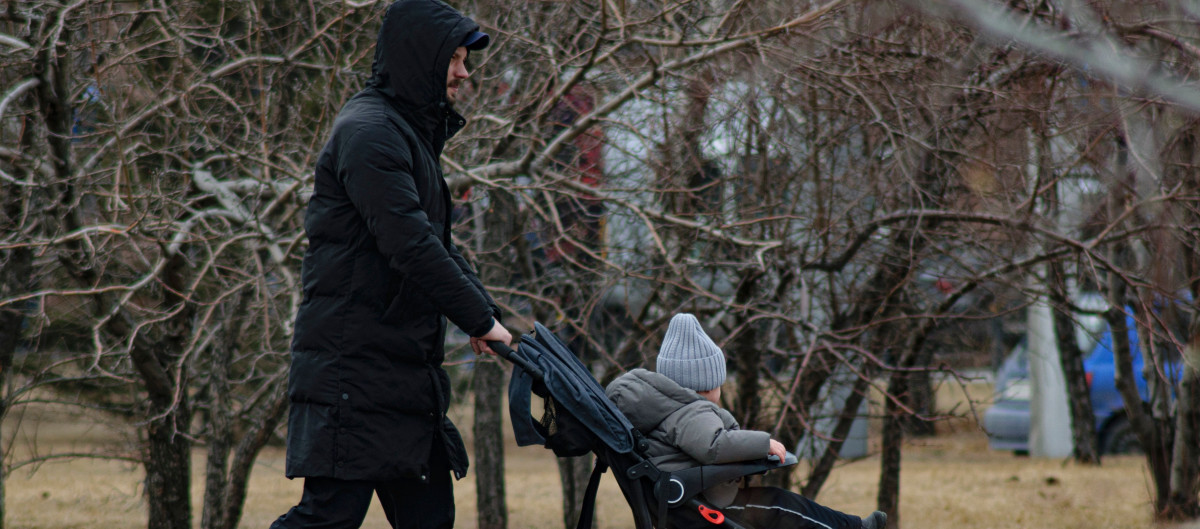 Man and small child in wintercoats